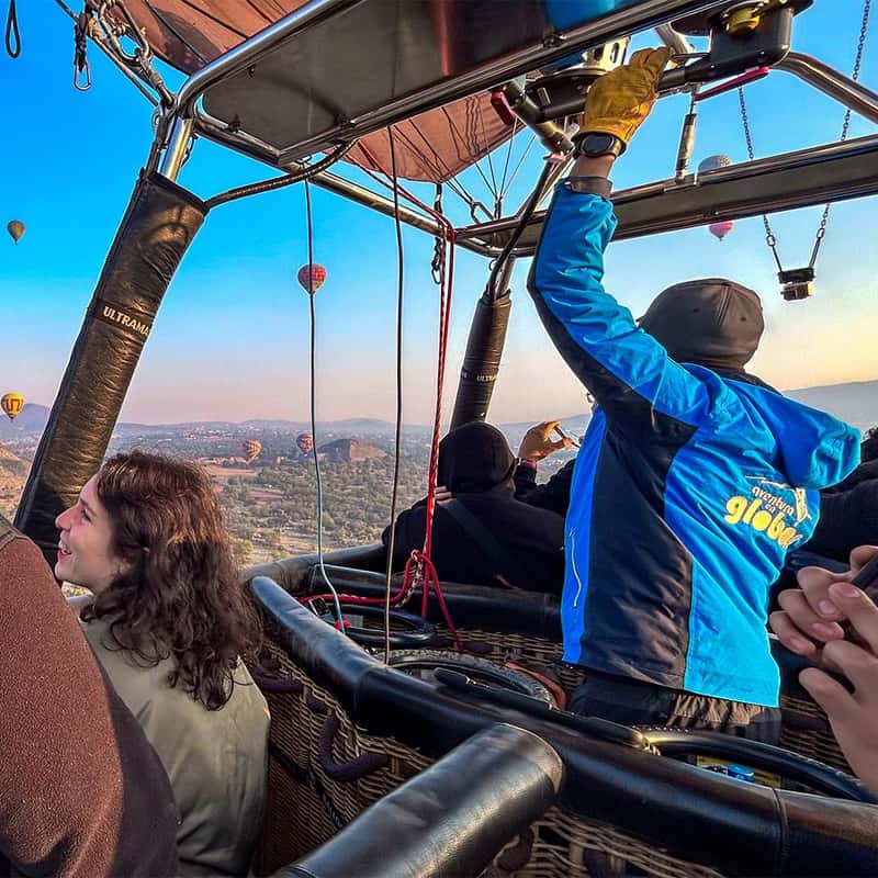 hot air balloon over teotihuacan pyramids