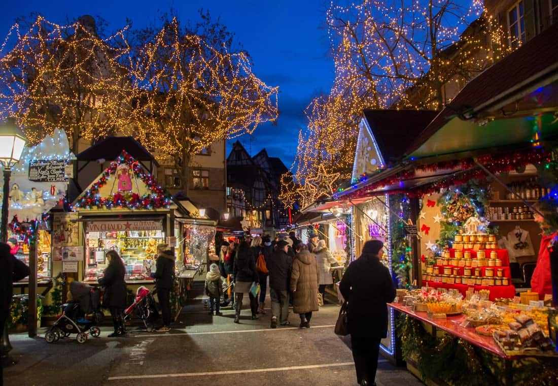 Stalls of a Christmas market at dusk — Alsace