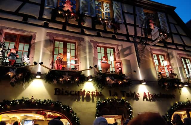 Colmar half-timbered street with Christmas decorations on the villages tour