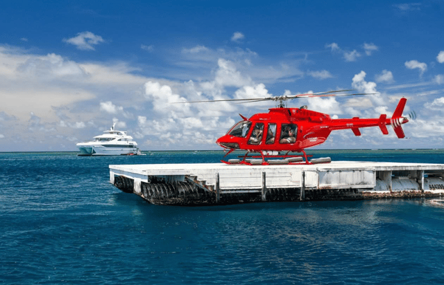 Superyacht reef + helicopter — Cairns