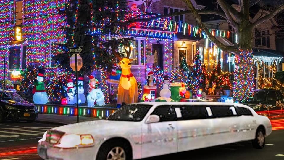 White stretch limousine passing a brightly lit decorated house