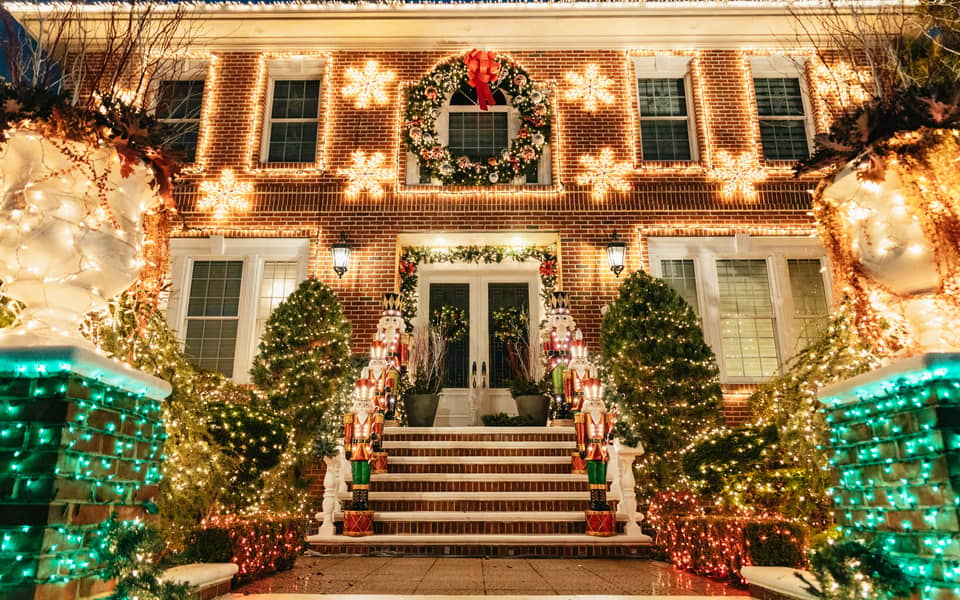 Brick house with wreath and light-up snowflakes