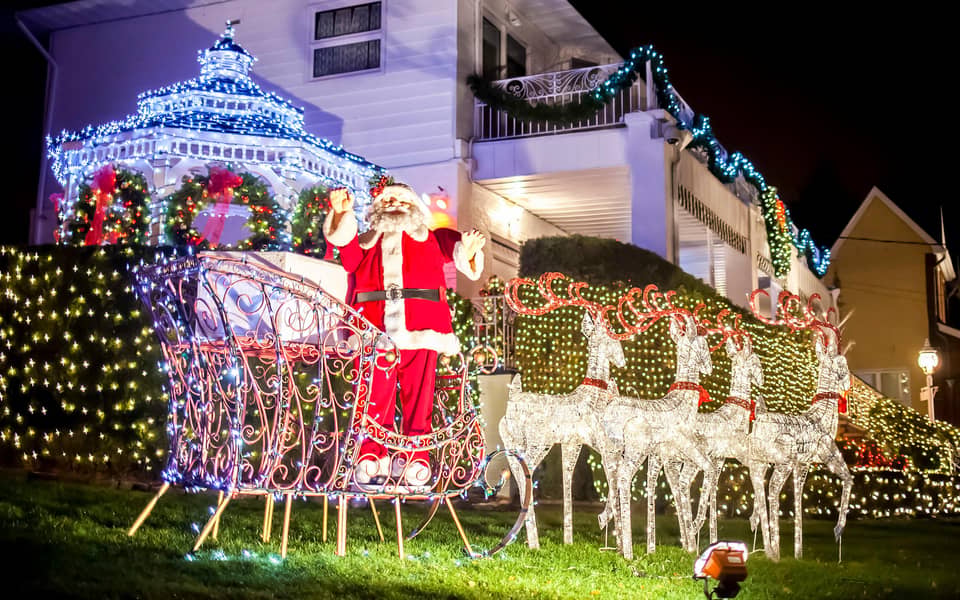 Santa sleigh with white reindeer on a lawn