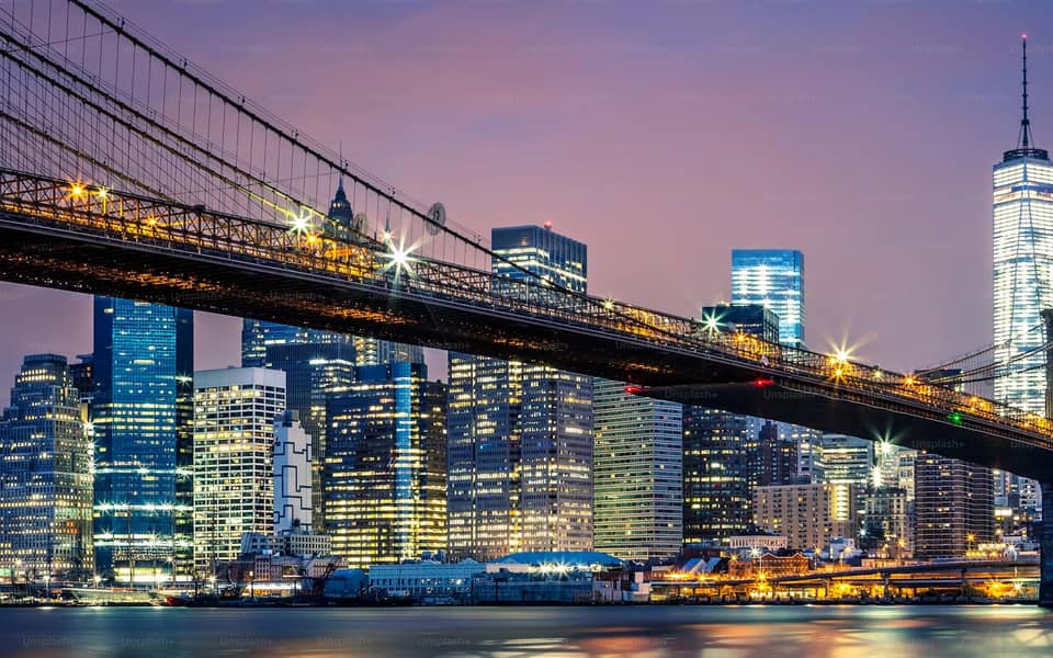 Brooklyn Bridge and lower Manhattan skyline at dusk