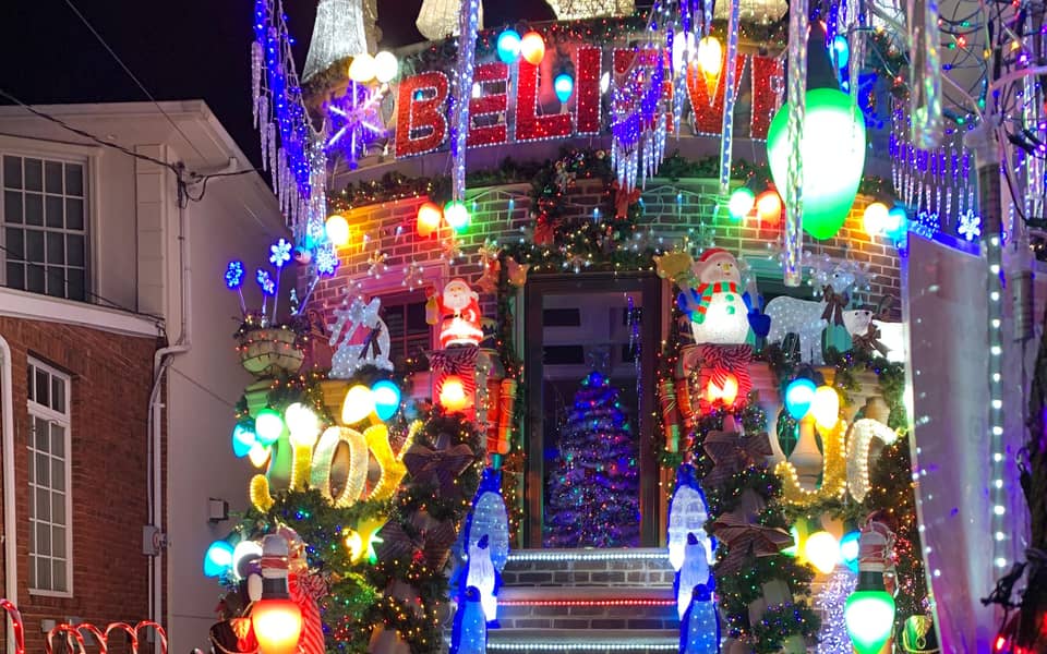 Doorway covered in colourful lights and figures
