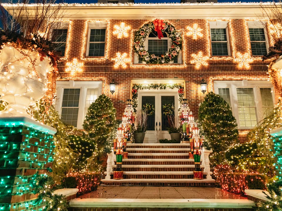 Brick house with wreath and light-up snowflakes