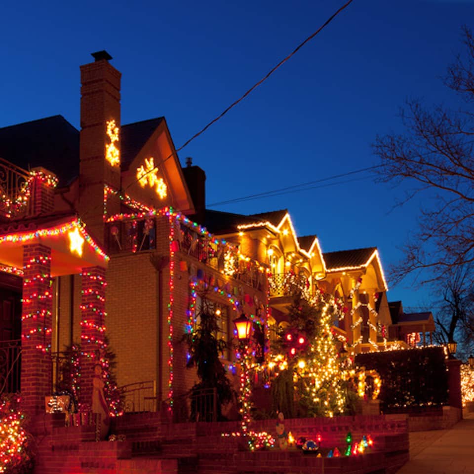 Street of lit houses at dusk