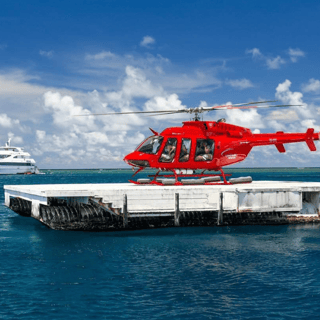 Superyacht reef + helicopter — Cairns