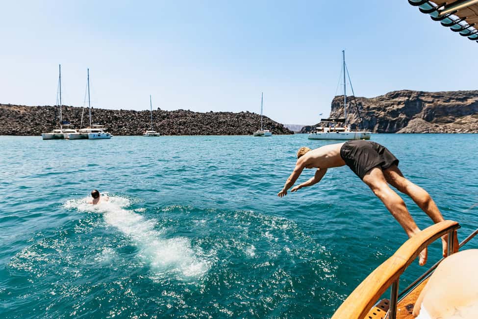 image n.4 of Santorini: Traditional Wooden Boat Tour with Meal and Wine activity in Cyclades, uploaded by supplier