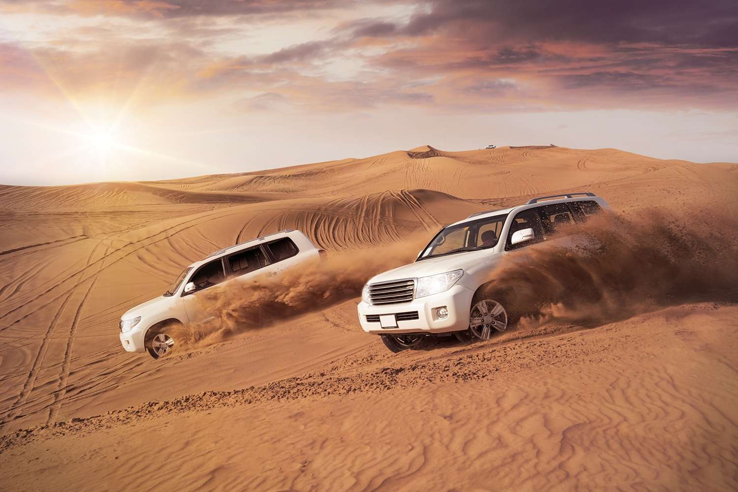 4×4 cruising across Dubai’s golden desert at sunset
