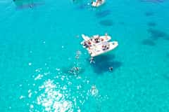 Boat Tour, 4 Stops, Swim, Snorkeling, & Spritz in this destination