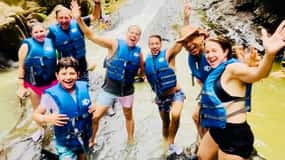 San Juan: Rainforest Waterslides & Beach Tour with Transport