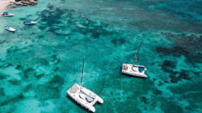 Paros: Private Catamaran Cruise with Meal, Drinks & SUP