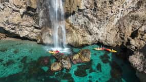 Nerja: Self-Guided Kayak Tour. Maro Waterfall. Support boat for the route.