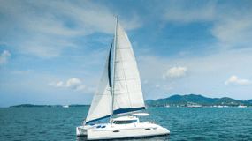 Phuket Catamaran Tour in Coral Island and Sunset Voyage