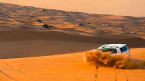 Dubai: Desert Safari, Camel Ride, Sandboard & Buffet Dinner