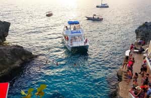 imagem n.3 de De Runaway Bay: Negril Beach e Rick's Cafe Trip by Van atividade em Negril, carregada pelo fornecedor