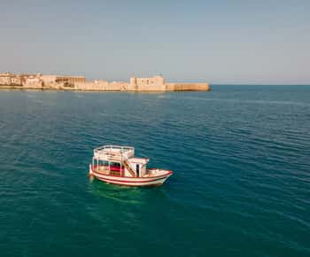Syracuse: Boat Trip with Lunch, Wine, and Swimming Stops