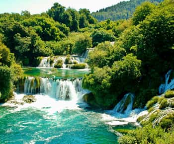 Vanuit Zadar: Krka watervallen dagtocht met boottocht & gids