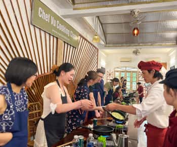 HCMC: Chef Vu Cooking Class, Cyclo Ride & Market Tour