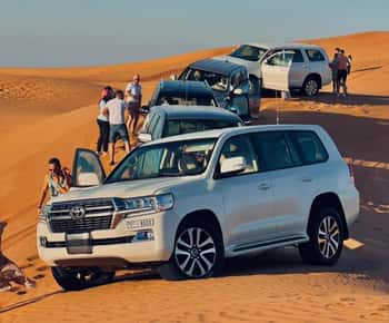 Doha: Sunset Desert Safari Camel Ride And SandBoarding