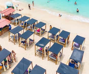 Tagestour zur Playa Tranquila VIP mit Sonnenschirmen, Mittagessen im Bus!