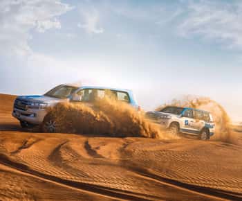Abu Dhabi: Desert Safari with BBQ, Camel Ride & Sandboarding