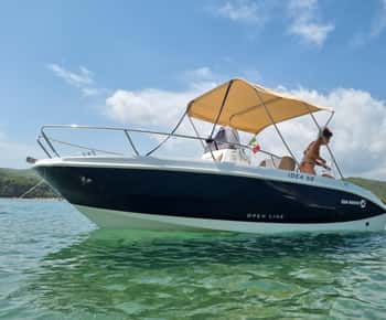 Private boat tour of the coast with swimming stop.