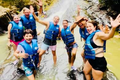San Juan: Rainforest Waterslides & Beach Tour with Transport