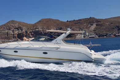 Fira: Private Day Cruise with BBQ, Drinks, & Hot Springs