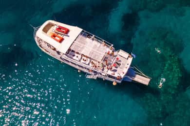 Rhodes: Bay to Bay Swim Cruise with Greek Buffet and Wine