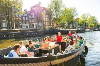 Amsterdam: Geführte offene Bootsfahrt mit unbegrenzten Getränken