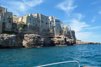 Coast and caves of Polignano:boat tours,drinks,swimming,music and fun