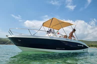 Private boat tour of the coast with swimming stop.