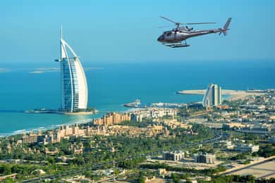 Dubai: Helicopter Ride, Old Town Walking Tour, Abra & Snacks