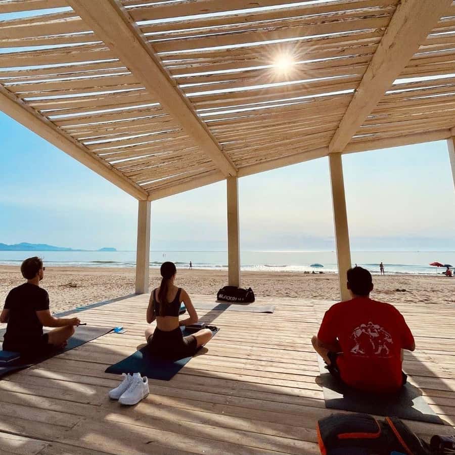 Yoga on the beach San Juan, Alicante GetYourGuide