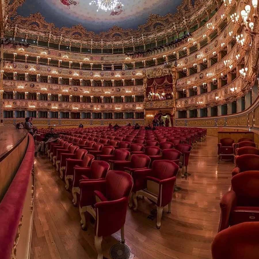 Renovated interior of La Fenice, with gilded balconies and red velvet seats