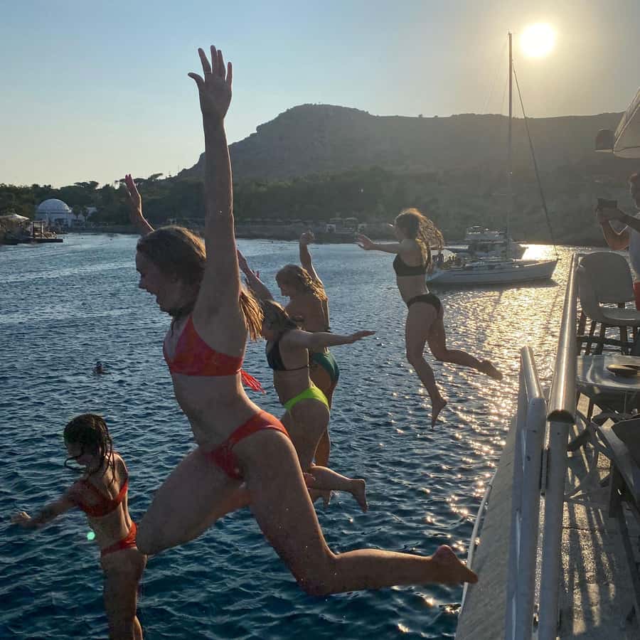 Rhodes: Bay to Bay Swim Cruise with Greek Buffet and Wine