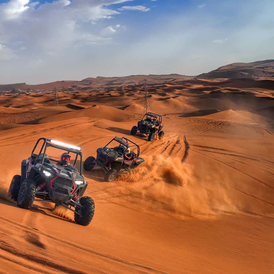 Dubai: Red Dunes Evening Quad Bike, Dune Blast with BBQ GetYourGuide