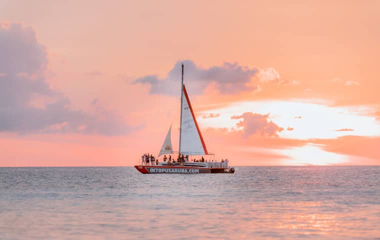 Sailing catamaran at sunset