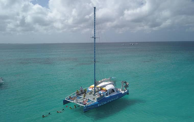 Catamaran anchored off Palm Beach with snorkelers