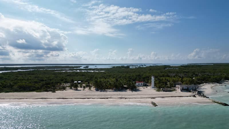Aerial view of Cabo Catoche: lighthouse, beach camp and mangroves