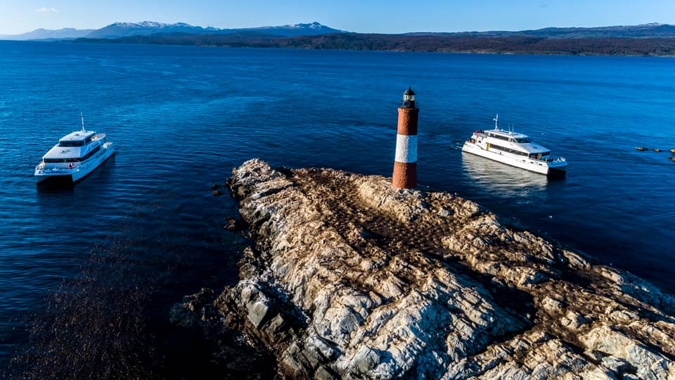 Two catamarans at Les Eclaireurs lighthouse, seen from above — photo from a GetYourGuide catamaran listing