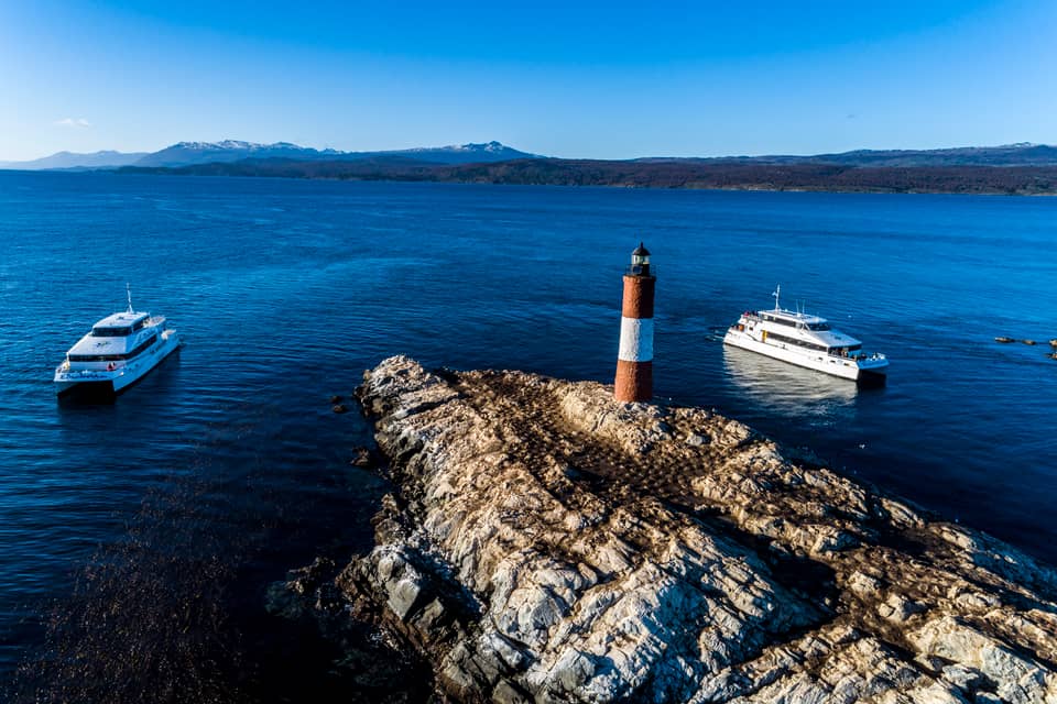 Aerial of two catamarans at Les Eclaireurs lighthouse — GetYourGuide listing