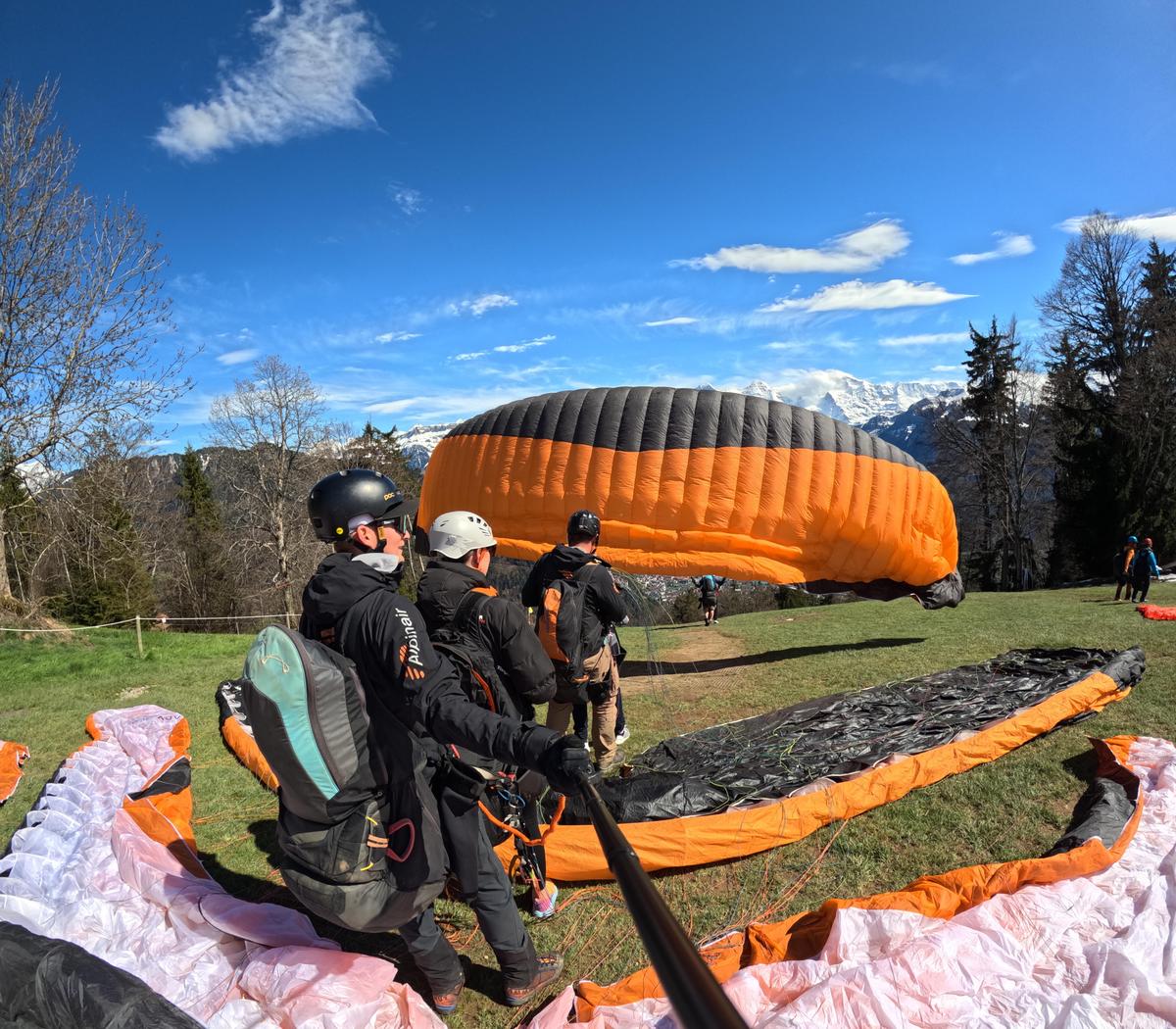 Paraglider landing on the Höhematte field in central Interlaken