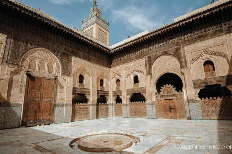 Serene ornate courtyard of Bou Inania Madrasa in Fes