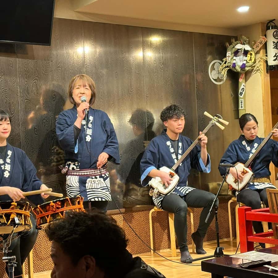 Tsugaru shamisen performance over traditional dinner | GetYourGuide