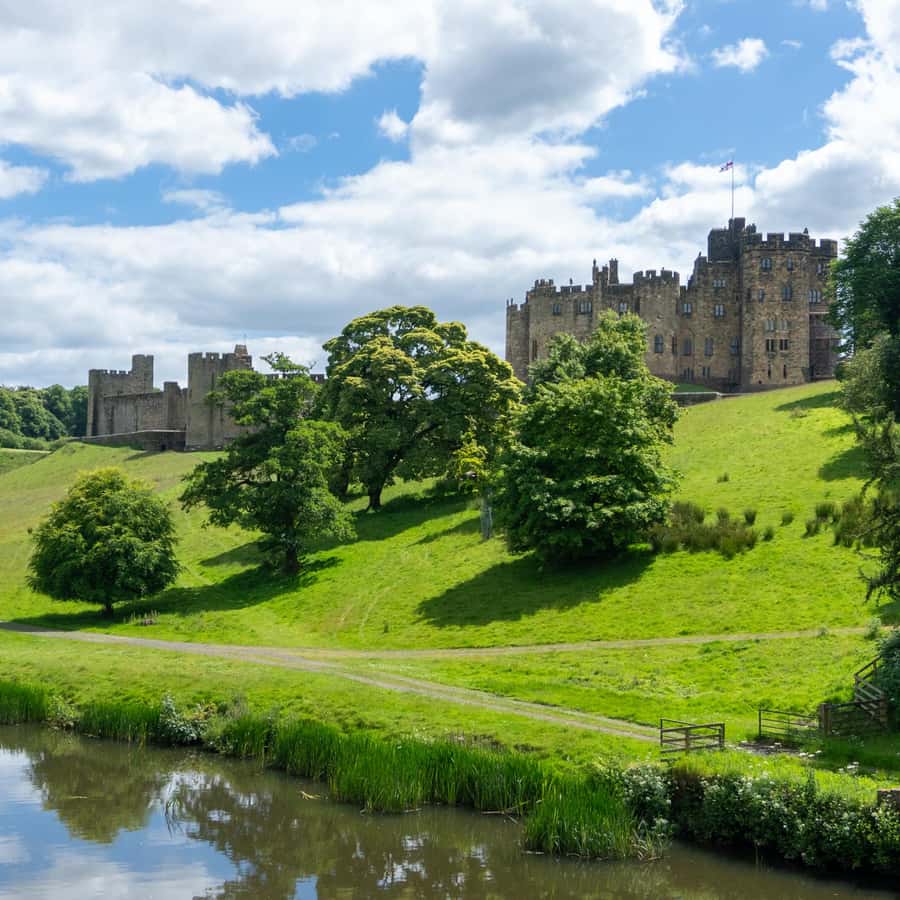 From Edinburgh: Day Trip to Bamburgh and Alnwick Castle | GetYourGuide, image size:900x900