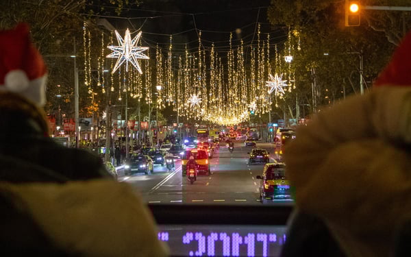 Red open-top hop-on-hop-off bus in Barcelona with the Sagrada Familia in the background on a sunny day. Red open-top hop-on-hop-off bus in Barcelona with the Sagrada Familia in the background on a sunny day.