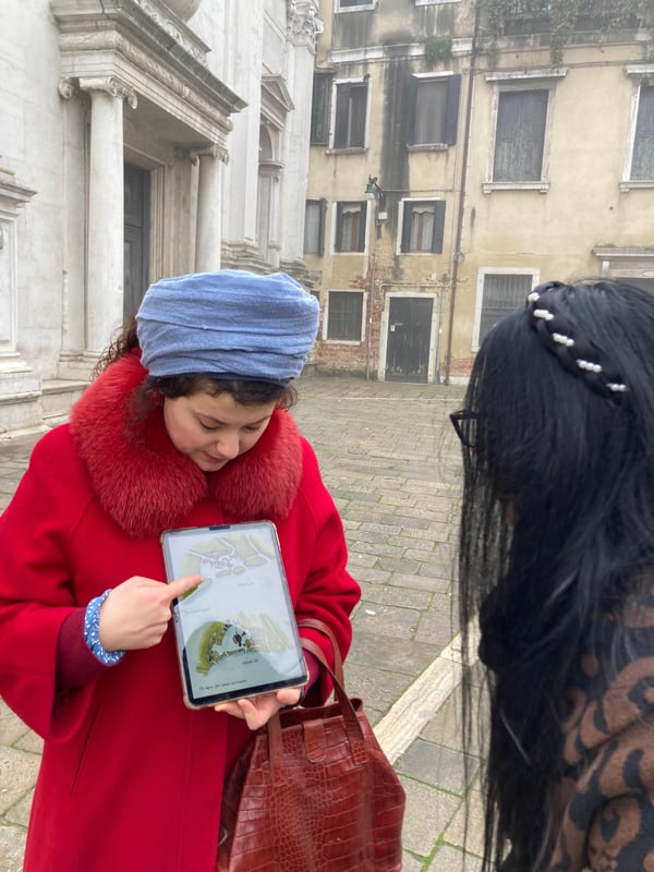 Small group on an expert guided walking tour in a narrow Venetian alley at sunset Small group on an expert guided walking tour in a narrow Venetian alley at sunset